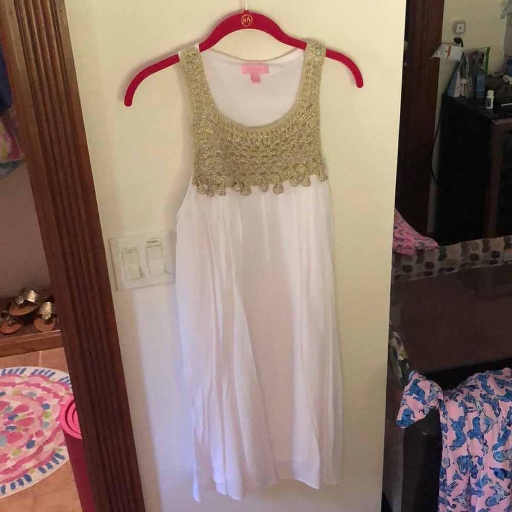 White flowy dress with gold detail